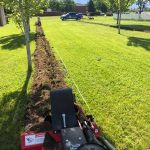 Using a trencher to dig a proper trench for irrigation piping